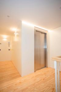 Kama o mga kama sa kuwarto sa Liiiving in Porto - Ribeira Design Apartment