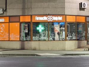 a store front of a building with tables and chairs at Garii Studio in Brăila