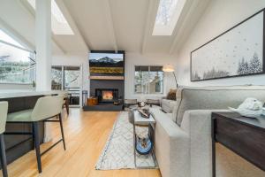 a living room with a couch and a fireplace at New Listing Just renovated 3BR 3BA in Snowmass Village