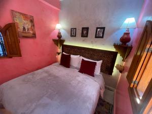 Postel nebo postele na pokoji v ubytování Riad ouhmidi