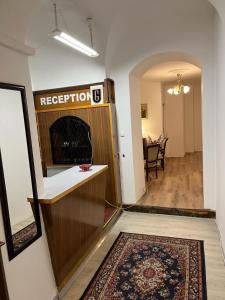 a living room with a fireplace and a hallway at City Hotel Post 12 in Braunau am Inn