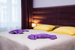 Cama o camas de una habitación en Domus Apartments
