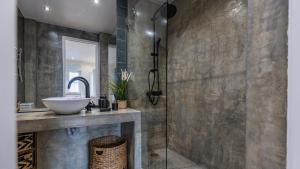 a bathroom with a sink and a mirror at Sunny Horizon Retreat by LovelyStay in Paço de Arcos +18 photos