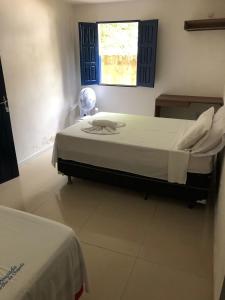 En eller flere senge i et værelse på Pousada Brilho da Chapada New