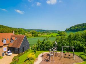 an aerial view of a house with a playground at Pass the Keys Bright Spacious Chilterns Hideaway in Saunderton