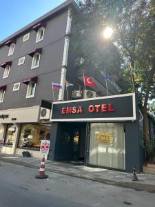 a store front of a building with a sign for an emesis office at Emsa Otel Maltepedeki Eviniz in Istanbul