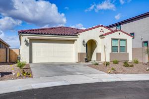 a white house with a large garage at Newly Built Glendale Home 5 Mi to Westgate! in Glendale