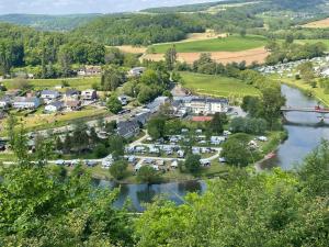 an aerial view of a town next to a river at Camping du Rivage in Wallendorf pont