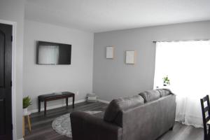 a living room with a couch and a table at Arctic 415 in Grand Rapids