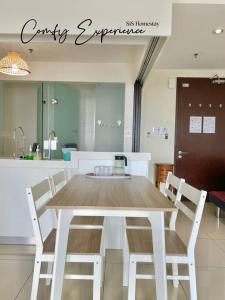 a table and chairs in a kitchen with a counter at GreeneryHome 1-4pax Trefoil Studio Setia Alam in Shah Alam