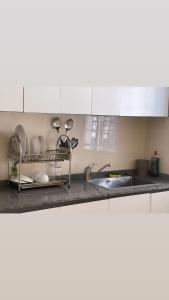 a kitchen with a sink and a counter top at louis LBV in Libreville