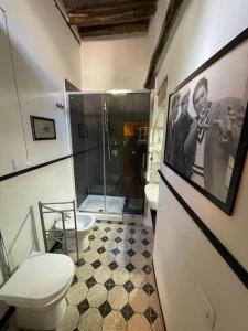 a bathroom with a toilet and a shower at Casa nonna Mimma in Narni +16 photos