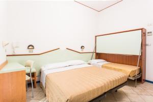 a hotel room with two beds and a whiteboard at Hotel Bellaria in Bellaria-Igea Marina +20 photos
