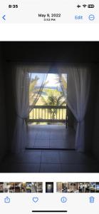 una imagen de una ventana con vistas a un porche en Oceanfront Luxury 2Br Villa en Saint Philip
