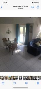 a living room with a table and a couch at Oceanfront Luxury 2Br Villa in Saint Philip