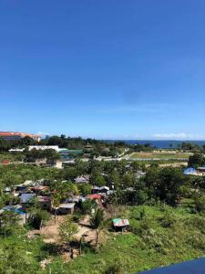 an aerial view of a village with houses and trees at Mactan Newtown By The Beach in Lapu Lapu City