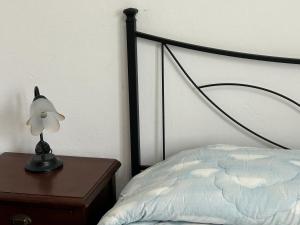 Una cama o camas en una habitación de Appartamento Deluxe I Cigni - Forio Ischia