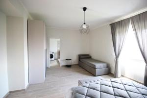 a living room with a bed and a couch at La Valle B&B in Castel Campagnano