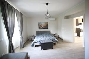a bedroom with a bed and a pendant light at La Valle B&B in Castel Campagnano +112 photos