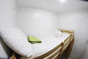 a small room with two bunk beds in it at Dickem's Transient House in Cebu City