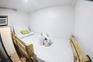 Postel nebo postele na pokoji v ubytování Dickem's Transient House