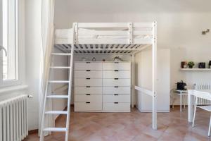 a white bunk bed in a room with a dresser at Relax sui Navigli in Milan