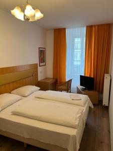 Postel nebo postele na pokoji v ubytování City Hotel Post 11
