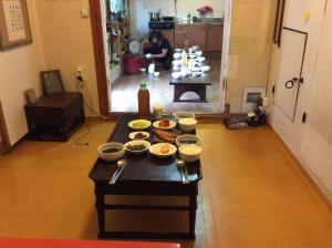 a table with bowls of food on it in a living room at Yangsajae in Jeonju