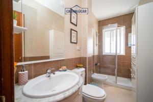 a bathroom with a sink and a toilet at Apartamento mi Gitana in La Jara +28 photos