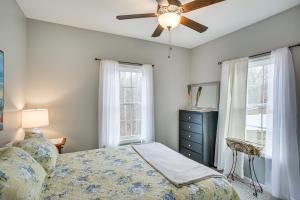 a bedroom with a bed and a ceiling fan at Winchester Home with Deck Less Than 1 Mi to Tims Ford Lake! in Winchester