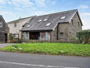 an old stone house with a gray roof at 2 bed in Gower 40480 in Dunvant