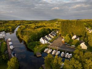 an aerial view of a river with boats docked at Leitrim Quay - Riverside Cottage 3 in Leitrim