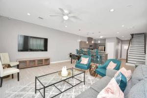 a living room with a couch and a table at Rodeo Ready!!!! Modern 3 bedroom home in Houston