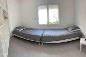 Cama ou camas em um quarto em Propriete de 3 chambres avec terrasse et wifi a Quetigny