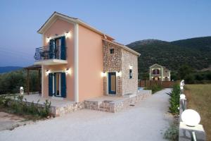 a house with a view of a mountain at Regina Ioanna Villas in Ayia Evfimia