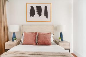 a bedroom with a bed with orange pillows at 69-4D Trendy Lower East Side 1B BRAND NEW in New York