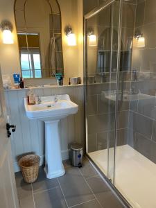 a bathroom with a sink and a shower at Townhead in Peebles