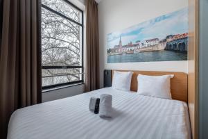 Ένα ή περισσότερα κρεβάτια σε δωμάτιο στο easyHotel Maastricht City Centre