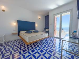 מיטה או מיטות בחדר ב-Amalfi Gioia House