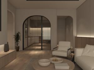 a living room with a couch and a chair at Broo in Kafr al Baţţīkh