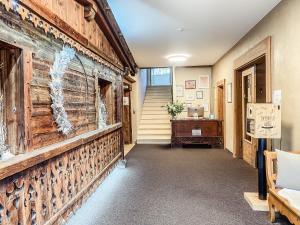 a hallway with a reclaimed wood wall in a house at KreativhausTirol in Weerberg