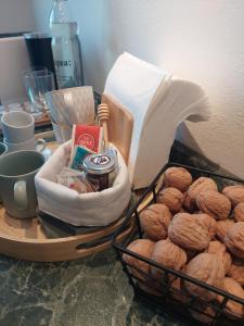a basket of nuts on a table with a basket of bread at Rosa d' Inverno in Piancastagnaio +43 photos