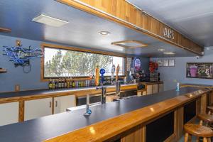 a large kitchen with a bar and a window at Rocker Inn in Butte