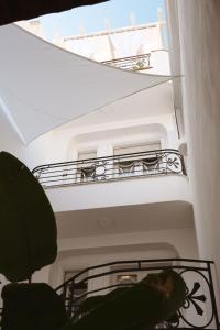 a spiral staircase in a building with a balcony at ALBERGO DIFFUSO ROSSI DIMORA Di CHARME in Turi