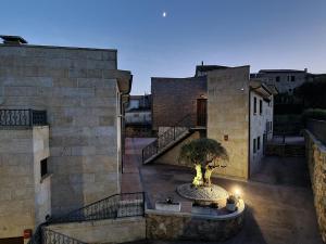 a view of a building with a tree in a courtyard at Hotel Apartamento Marouco in A Guarda