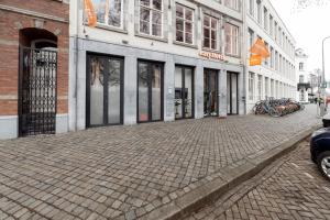 a cobblestone street in front of a building at easyHotel Maastricht City Centre in Maastricht