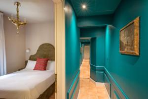 Cama ou camas em um quarto em Daplace - Antica Casa Coppo
