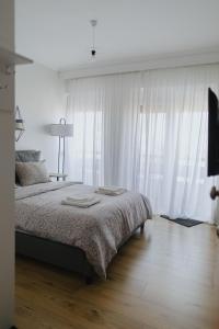 Postel nebo postele na pokoji v ubytování Cozy Studio Komotini