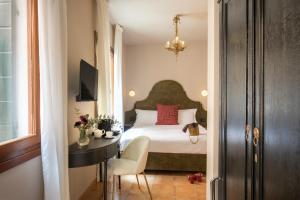 Cama ou camas em um quarto em Daplace - Antica Casa Coppo