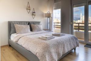 Postel nebo postele na pokoji v ubytování Cozy Studio Komotini